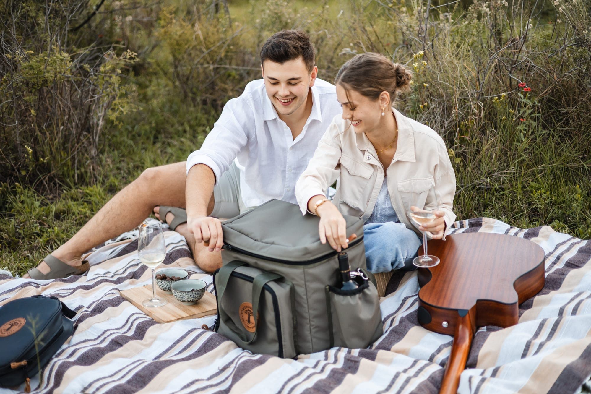 Couple on a picnic with Towering Tree cooler