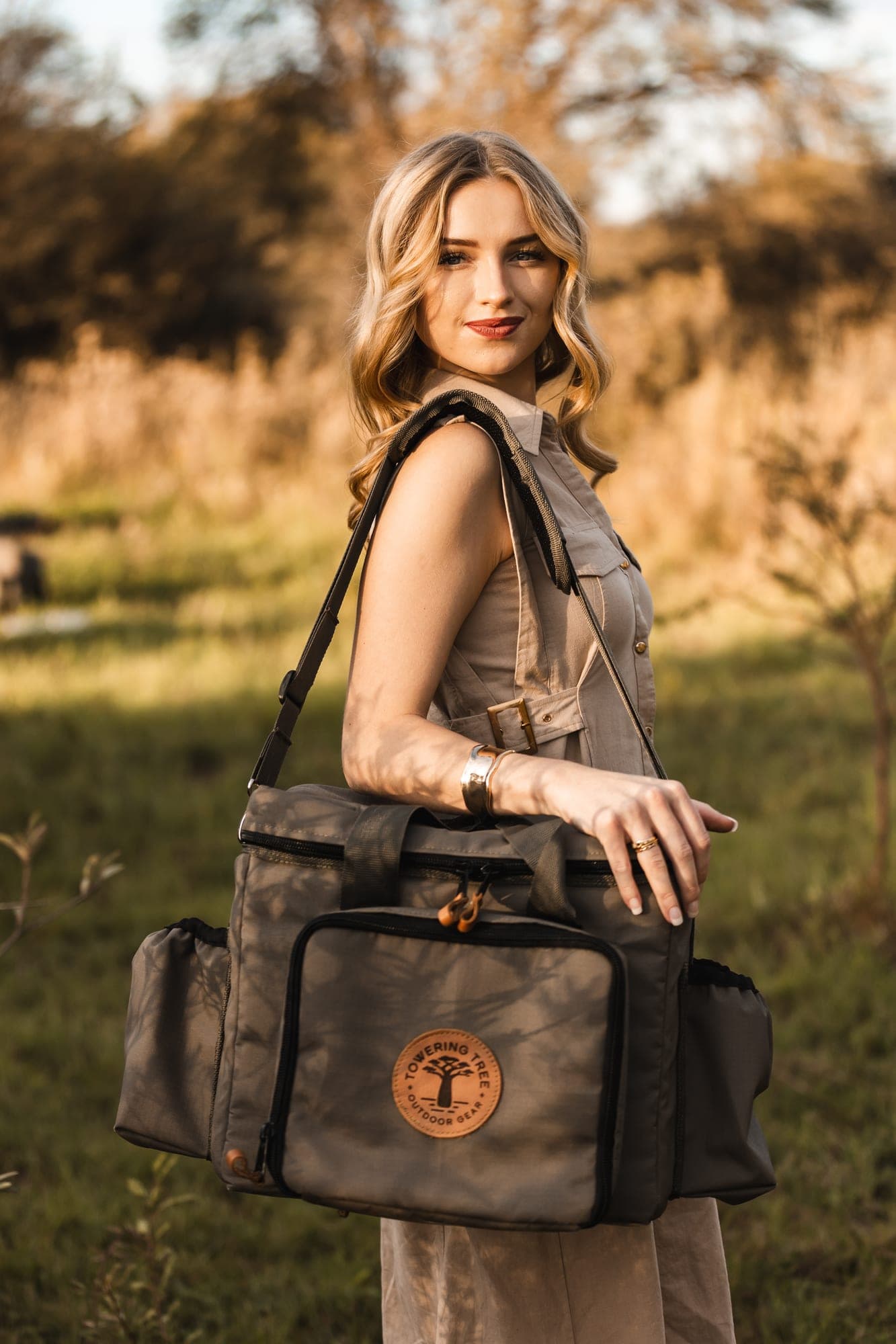 Woman carrying Towering Tree bag in the bush