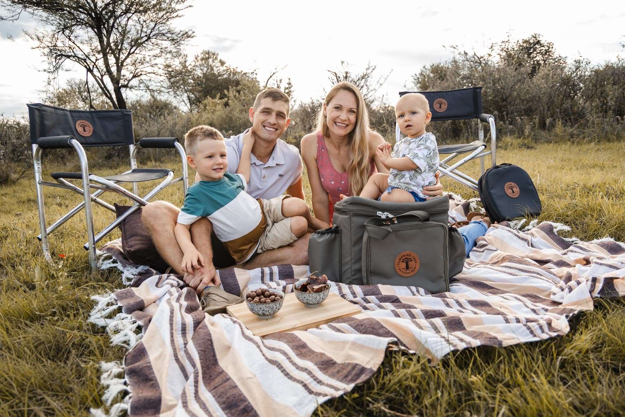 Young family picnic with Towering Tree gear in the veld