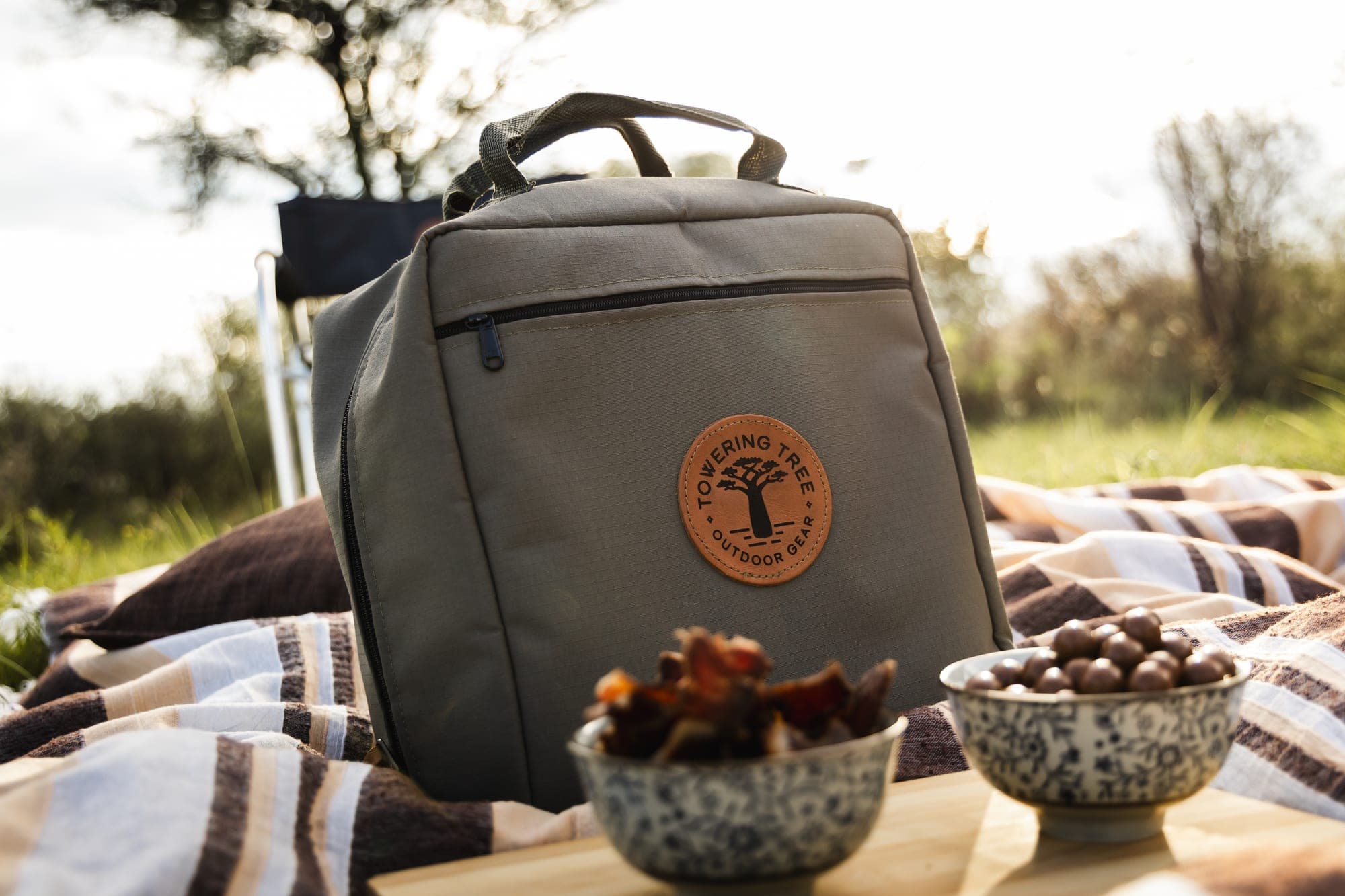 Cooler backpack on picnic blanket in the veld